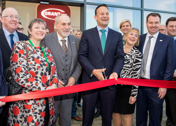 Irish Taoiseach Leo Varadkar cuts the ribbon watched by Stephen Grant, third from left,and Niall Fay, second from right