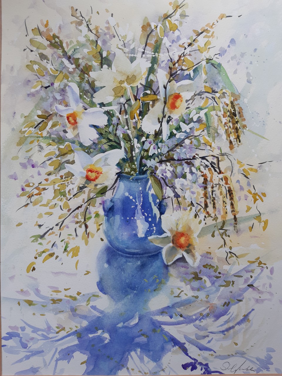 April flowers in a blue pot